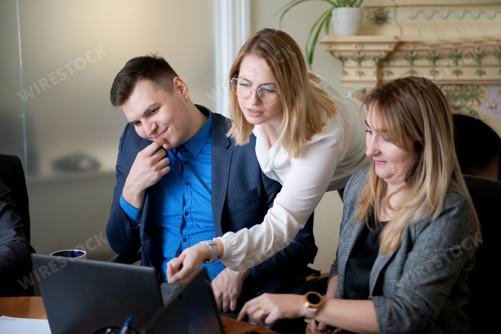 Roundtable meeting of business partners. Business people team using laptops computers.