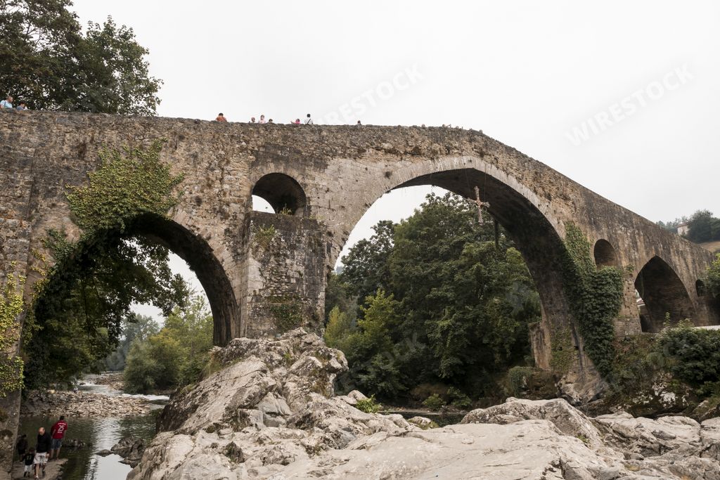 An old Roman stone bridge in Cangas de Onis over the river in Spain