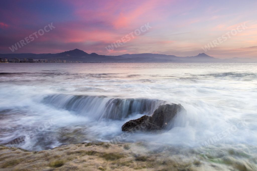 The purple sky over the sea during sunset