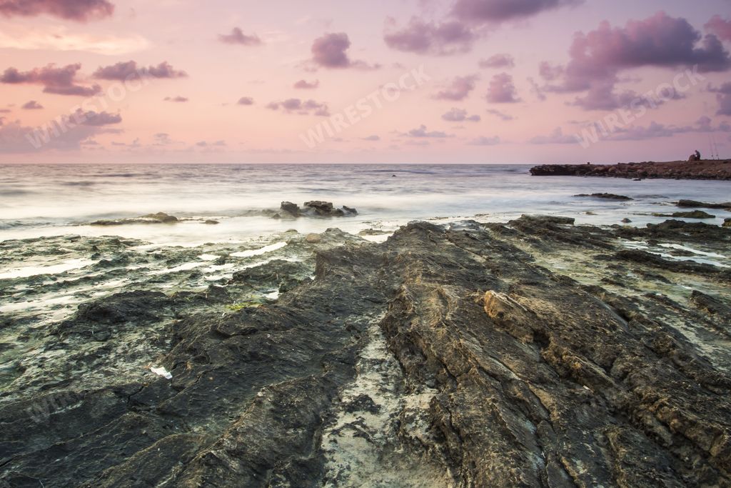The purple sky over the sea during sunset