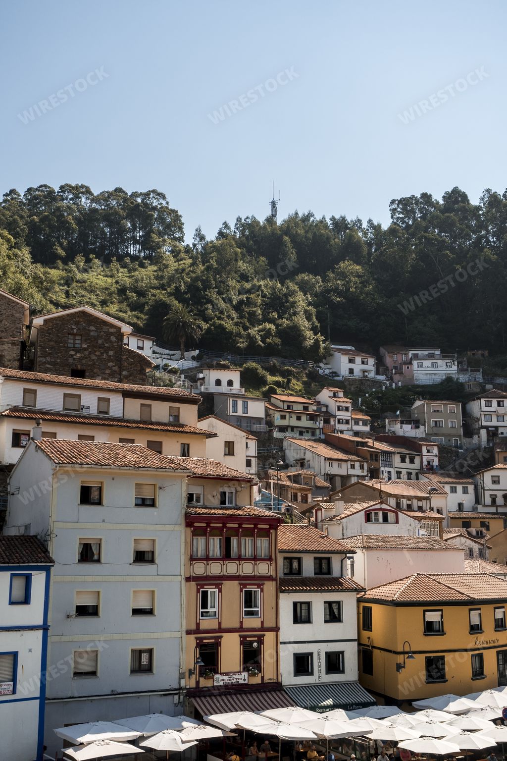 The colorful houses under a blue sky  in the coastal town of Cudillero in Spain