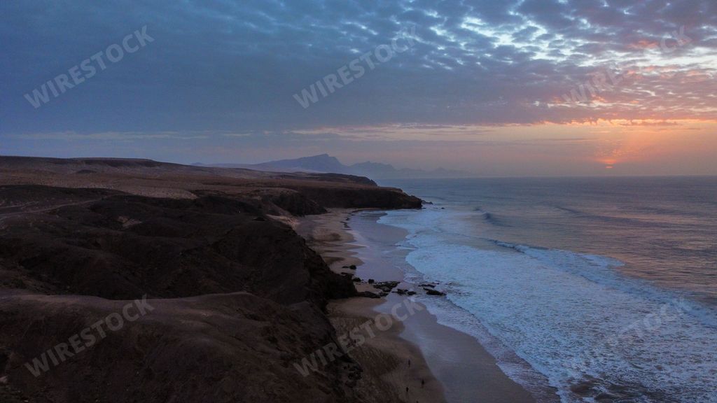 A 4K stunning view of the beach at sunset.