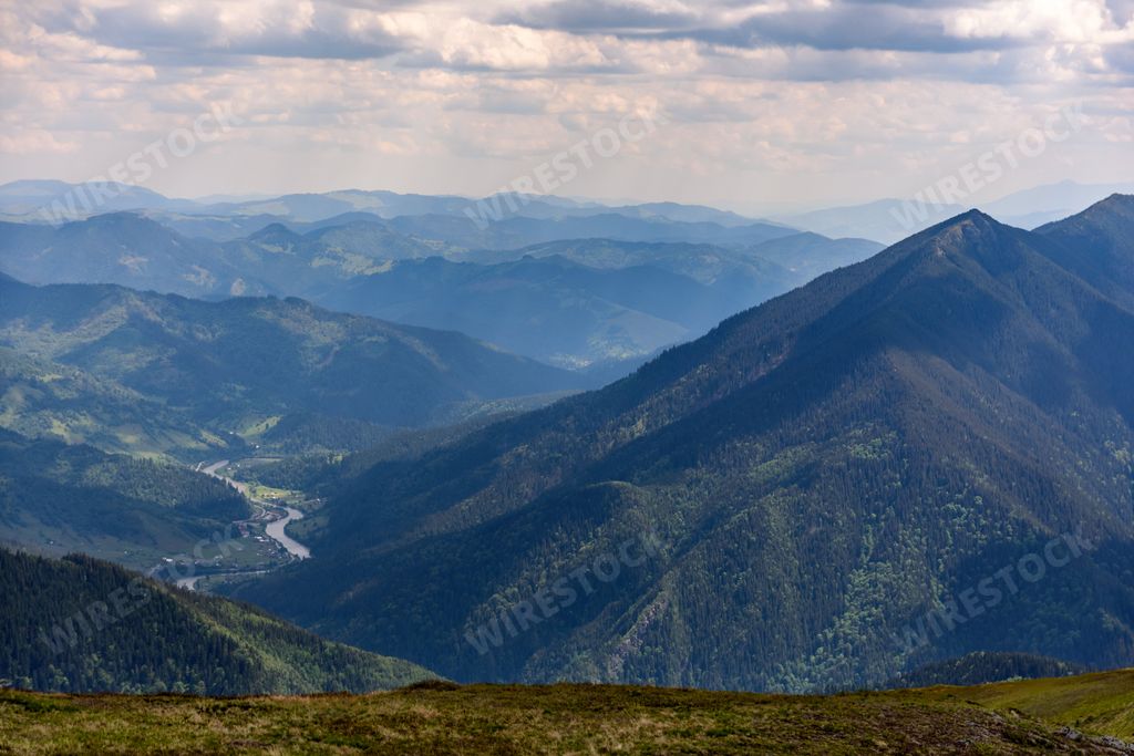 Idyllic view of scenic Rarau Mountains on foggy day, Romania