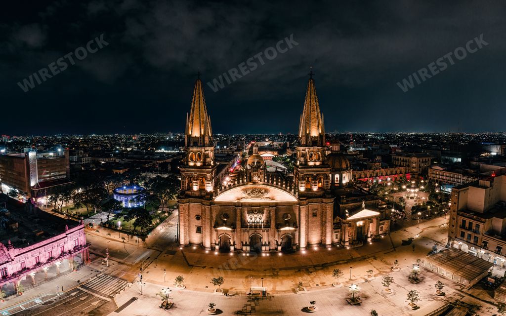 An aerial perspective of the historic Cathedral of Guadalajara, Jalisco, Mexico, illuminated in the night time