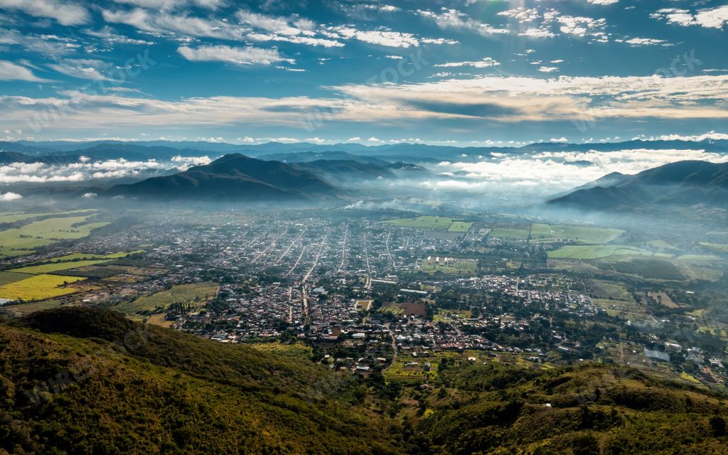 An aerial view of Tuxpan with majestic mountains in the background. Jalisco, Mexico