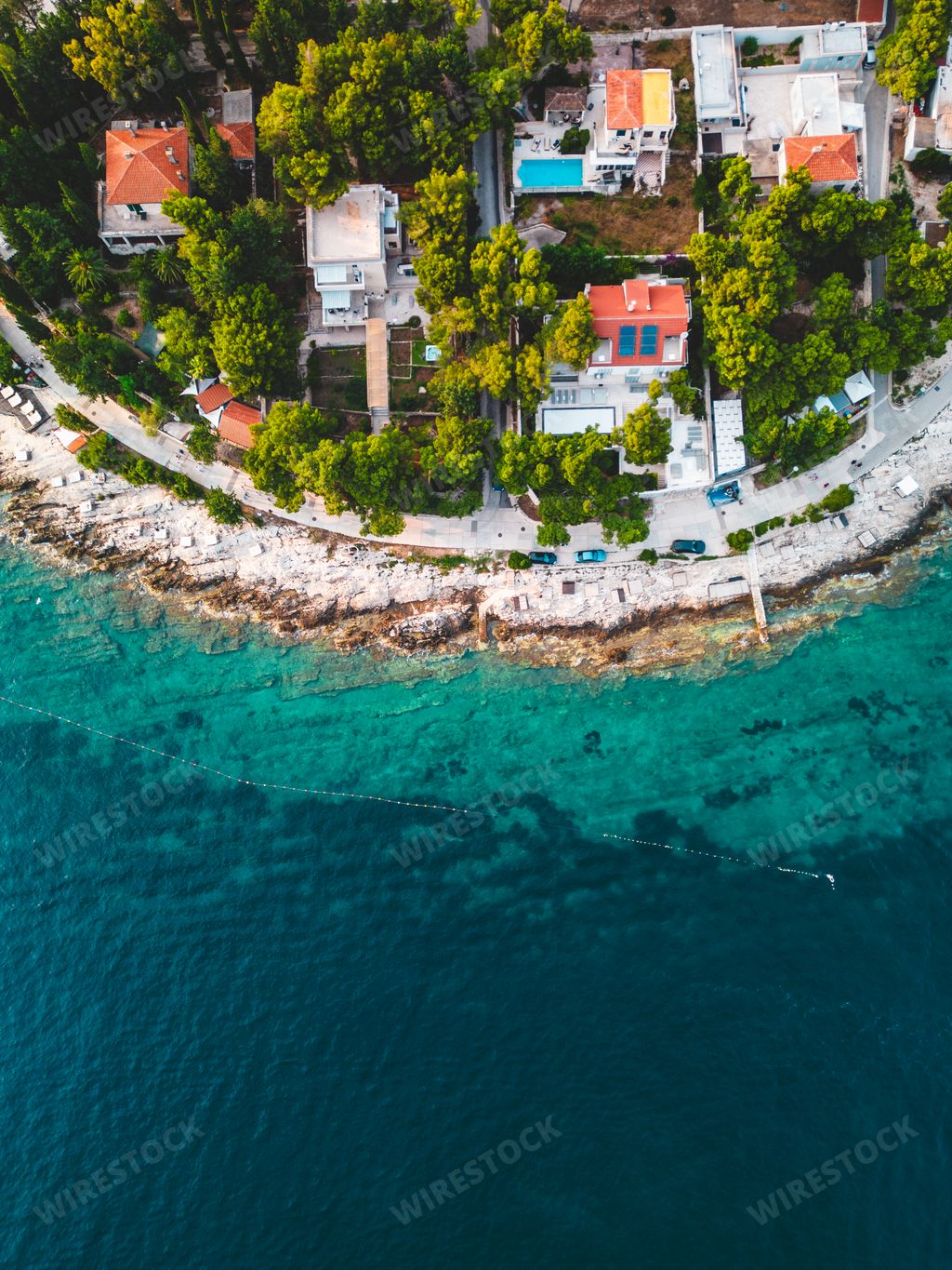 An aerial view of a serene coastal town surrounded by turquoise waters. Croatia