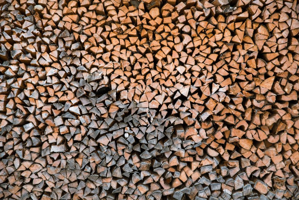 A background of a stack of firewood.