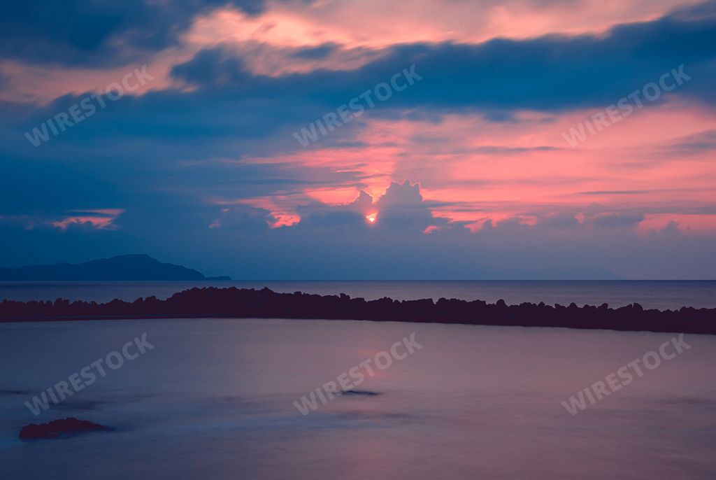 A cloudy sunset sky over a sea in Greece