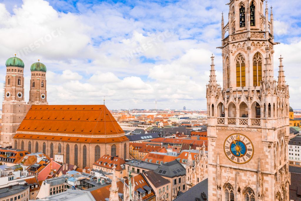 A closeup shot of beautiful New Town Hall (Rathaus) and cathedral Frauenkirche in Marienplatz, Munich, Germany