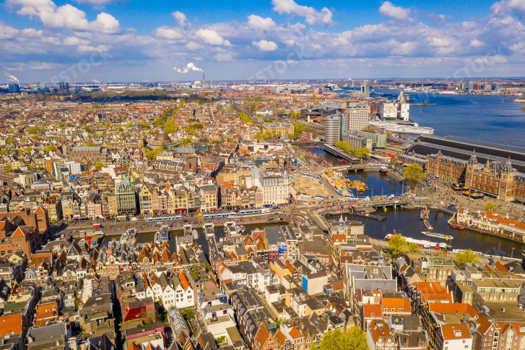 A beautiful aerial view of Amsterdam, the Netherlands with narrow streets and anals