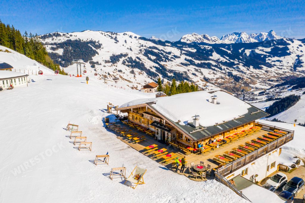 A beautiful aerial view of the ski resort village and mighty Alps