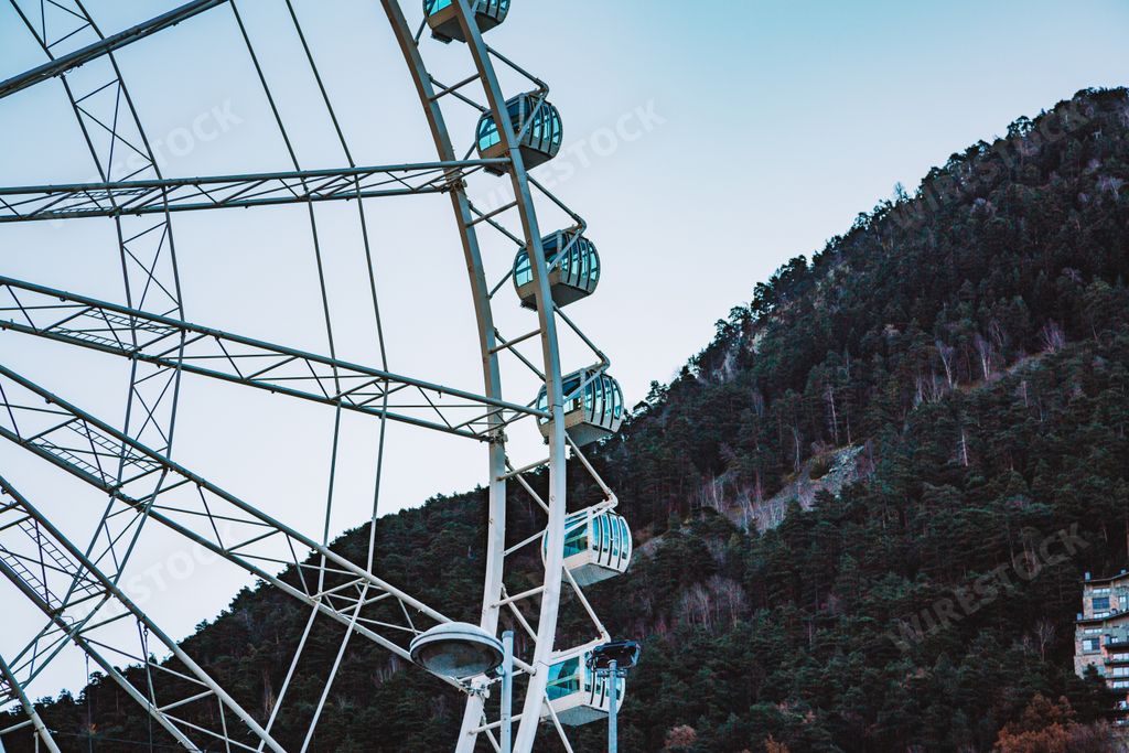 A low angle shot of Andorra Ferris wheel during a daytime