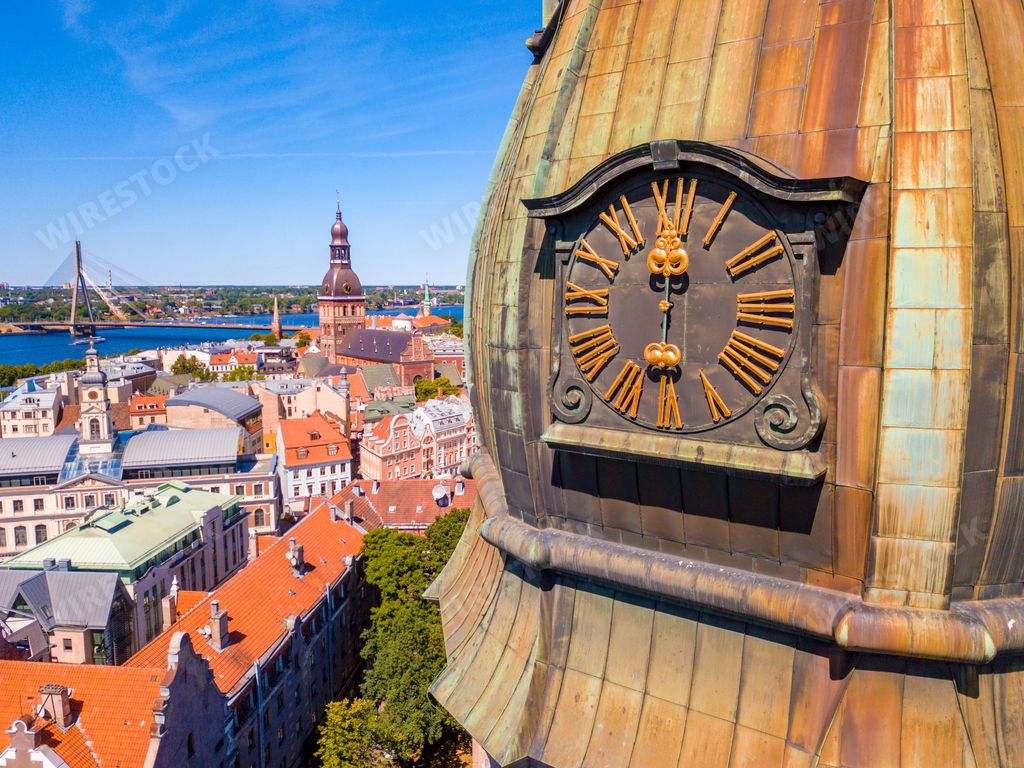 A closeup of a clock tower of St. Peter's Church in Riga