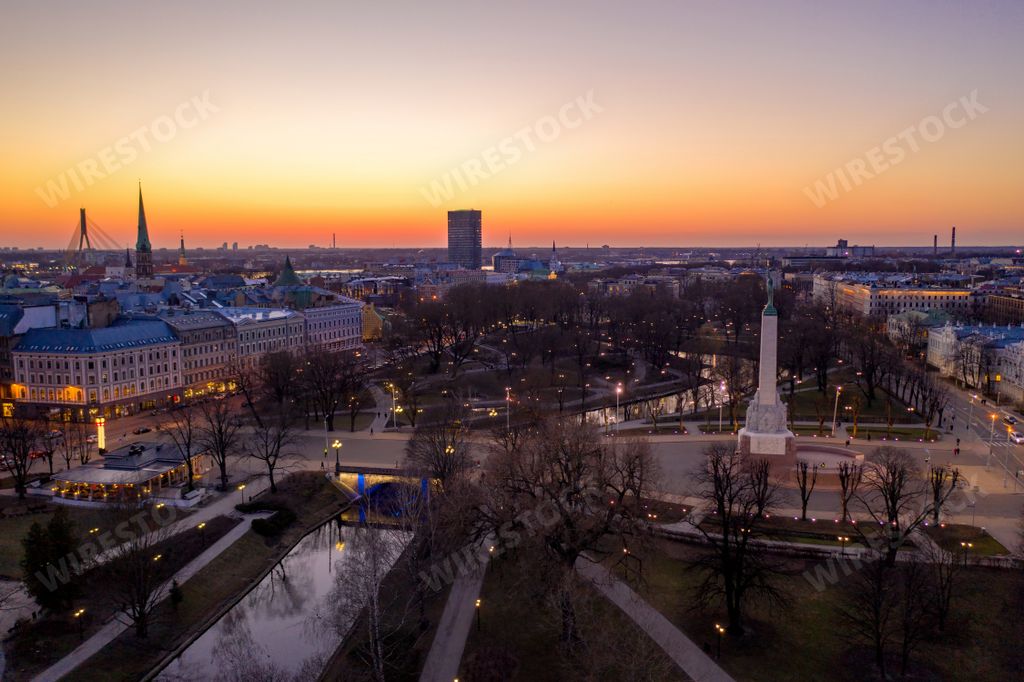 An aerial view of lovely Riga during beautiful twilight sunset with street lights all over the city