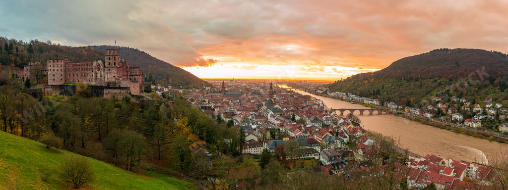 A scenic aerial shot of Heidelberg, Germany at the orange sunset