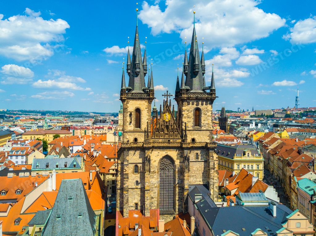 The Church of Our Lady before Tyn surrounded by buildings under the sunlight in Prague, Czech Republic