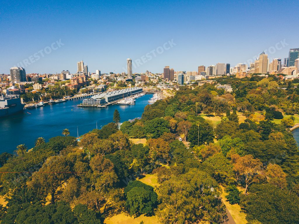 An aerial view of the Sydney city from above with Harbour bridge, Opera house and the harbour