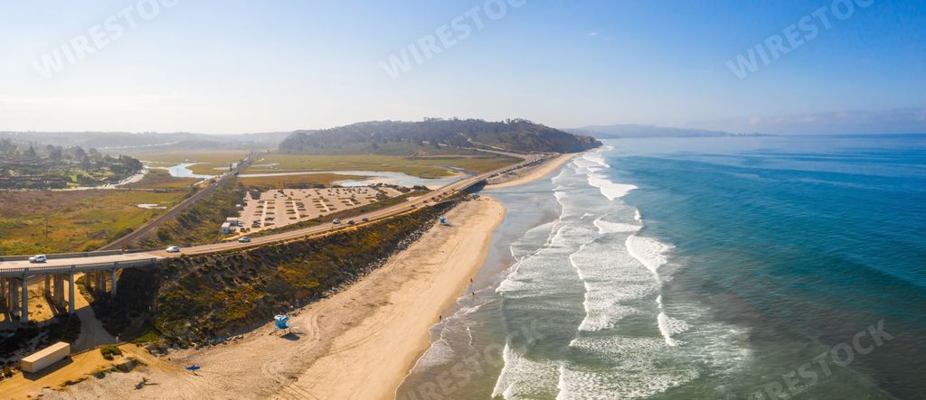 A panoramic aerial shot of the San Diego coastline on a bright day