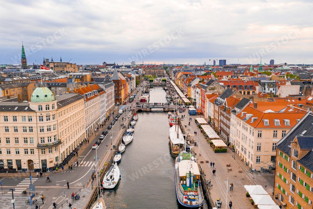 An aerial shot of a cityscape with a river flowing in the middle - perfect for background
