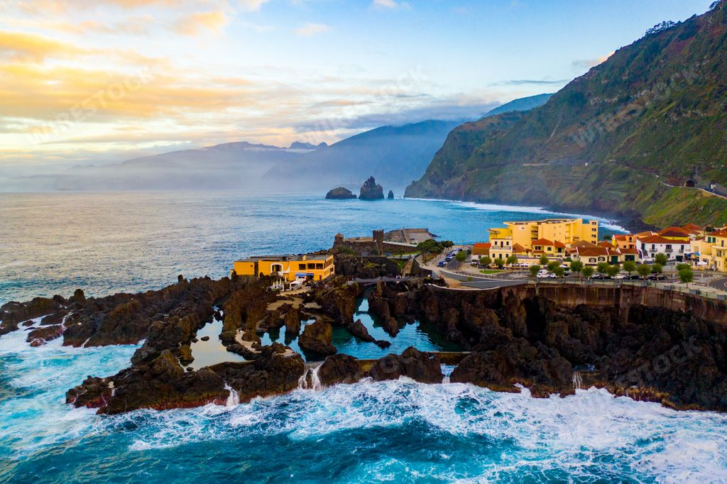 An aerial shot of the volcanic lava swimming pool at Porto Moni in Madeira Island, Portugal