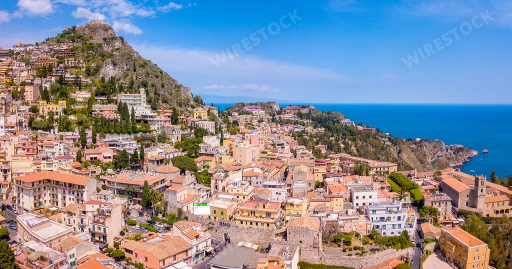 An aerial shot of the buildings near the sea in Taormina, Italy