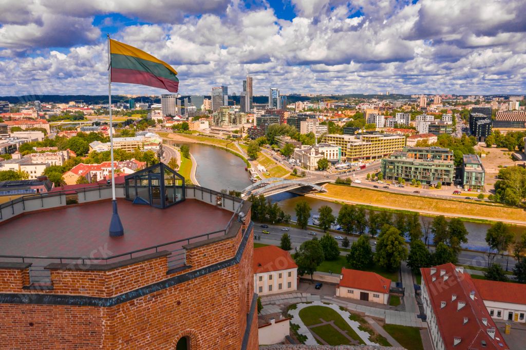 An aerial view of Gediminas castle in capital Vilnius of Lithuania with Lithuanian flag on the tower