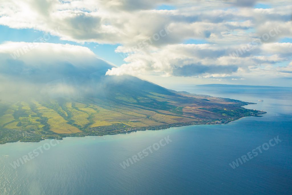An aerial view of the beautiful Maui Island under the cloudy sky in Hawaii