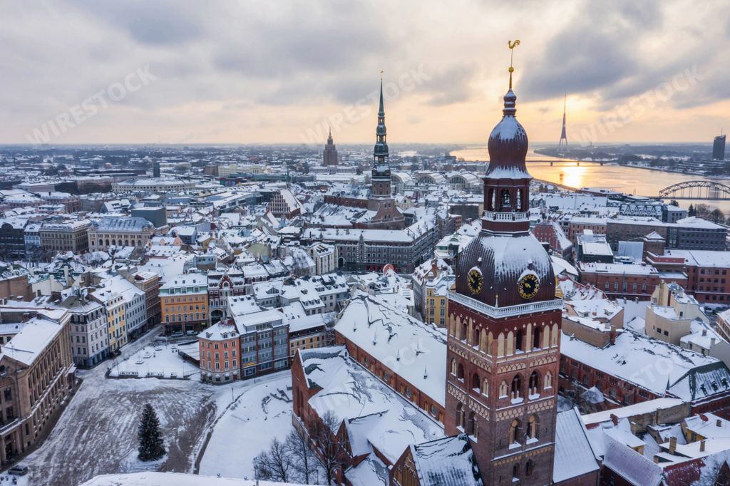An aerial view of Dome Cathedral and the Old Riga Town at sunset in winter