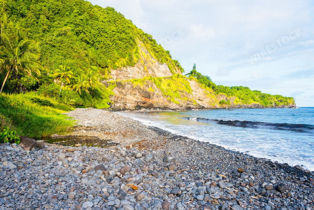 The wavy ocean hitting the rocky beach in Maui Island, Hawaii