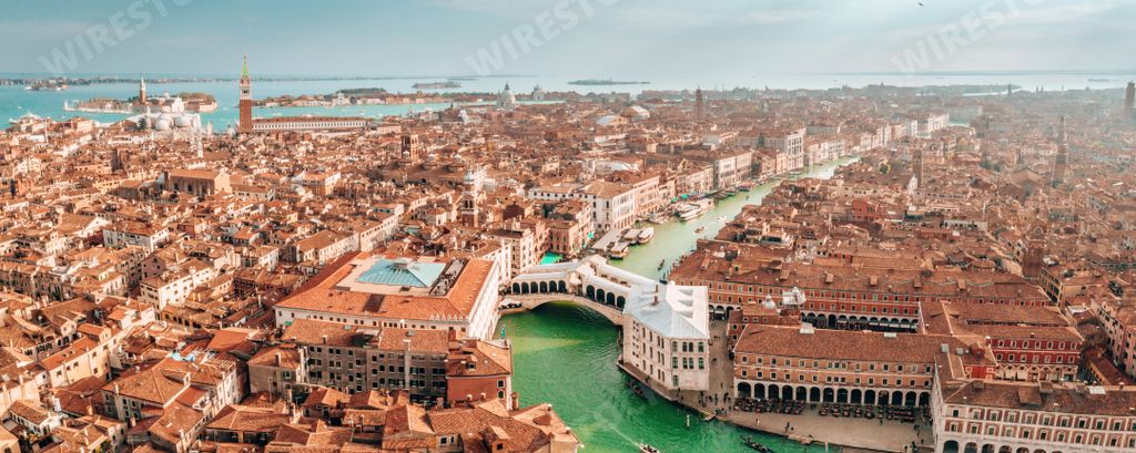 A panoramic aerial view of cityscape of Venice with Santa Maria Della Salute church and Rialto bridge in Italy