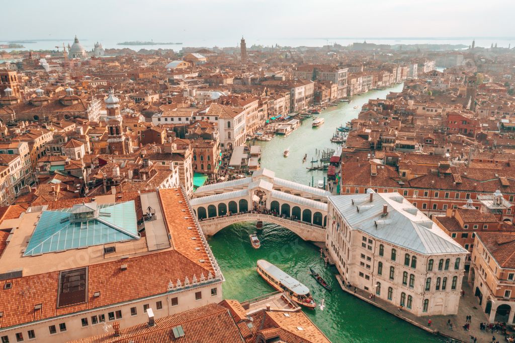 An aerial shot of the Rialto Bridge in Venice, Italy, a beautiful cityscape