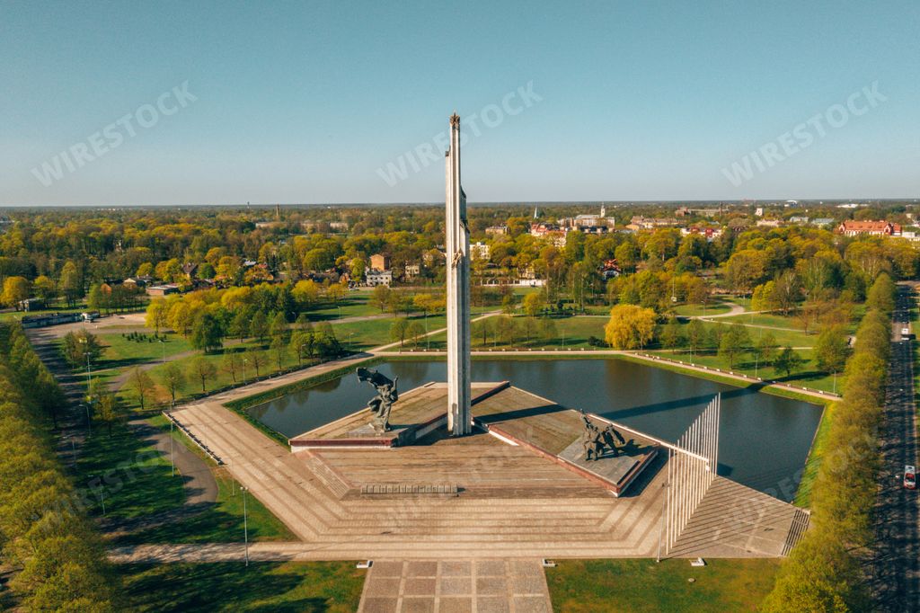 An aerial shot of the Soviet Victory Monument under the sunlight in Riga, Latvia
