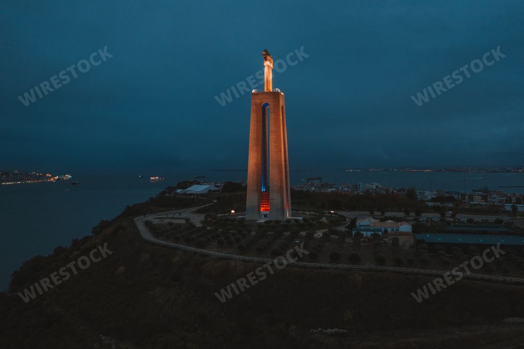 The Cristo Rei Christ Statue in Lisbon, Portugal in the evening