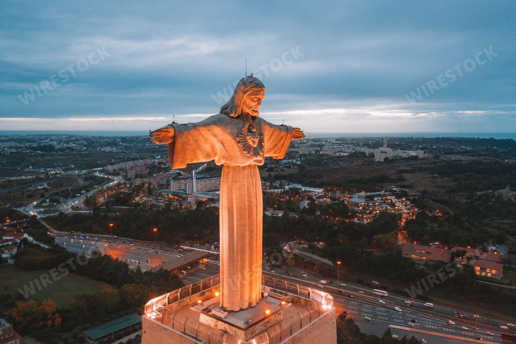The Cristo Rei Christ Statue in Lisbon, Portugal in the evening