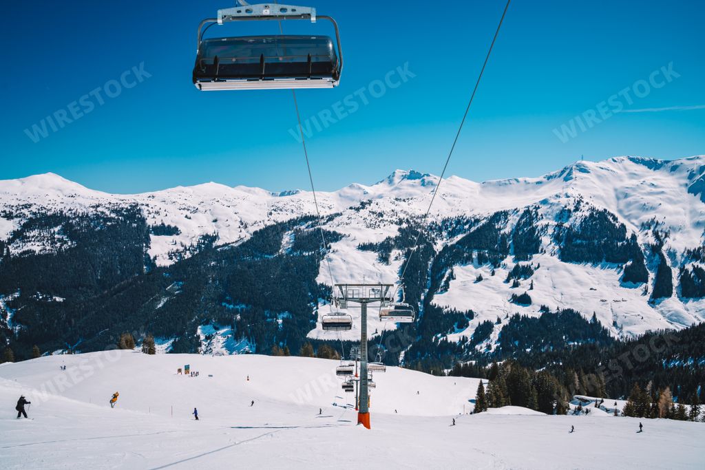 A beautiful shot of ski lifts and cable cars in Saalbach ski resort during winter time
