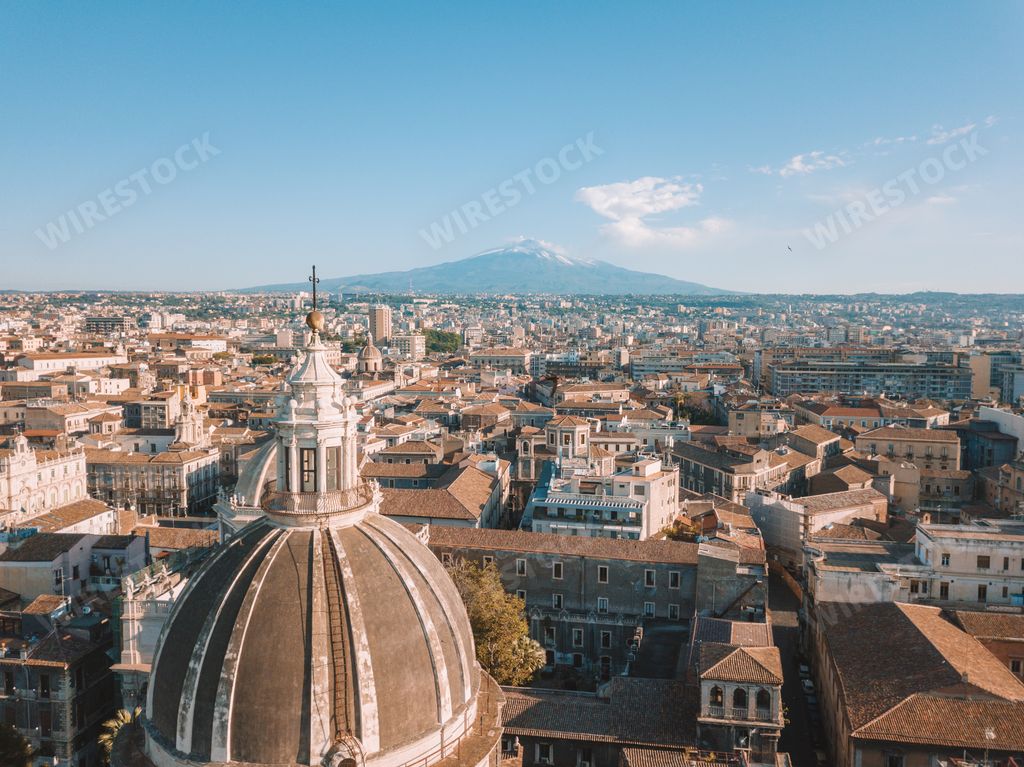 An aerial view of buildings and cathedral domes in Catania, Italy