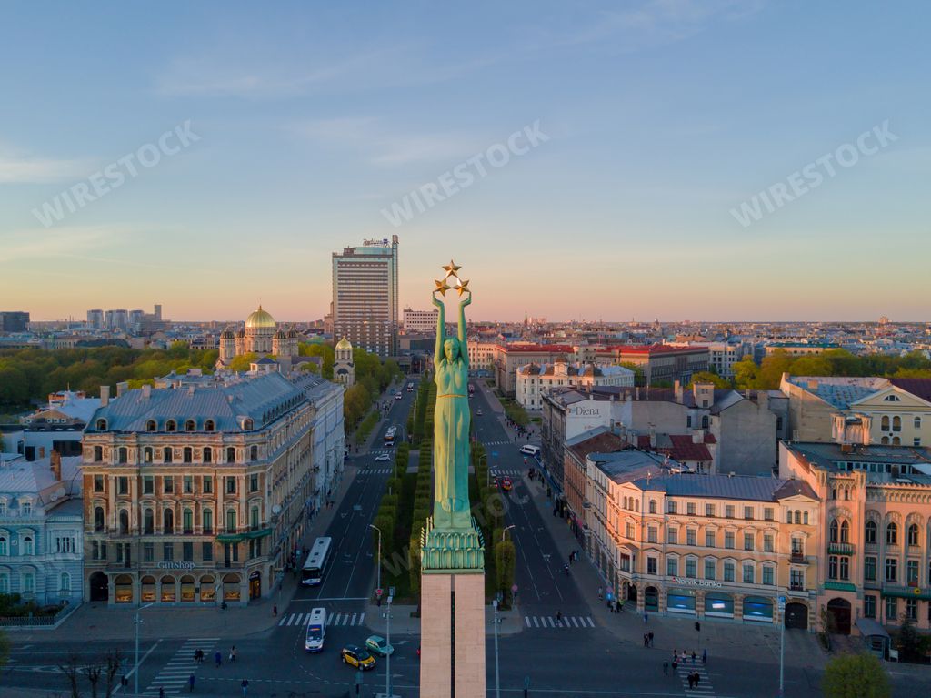The Freedom Monument surrounded by buildings in Riga, Latvia