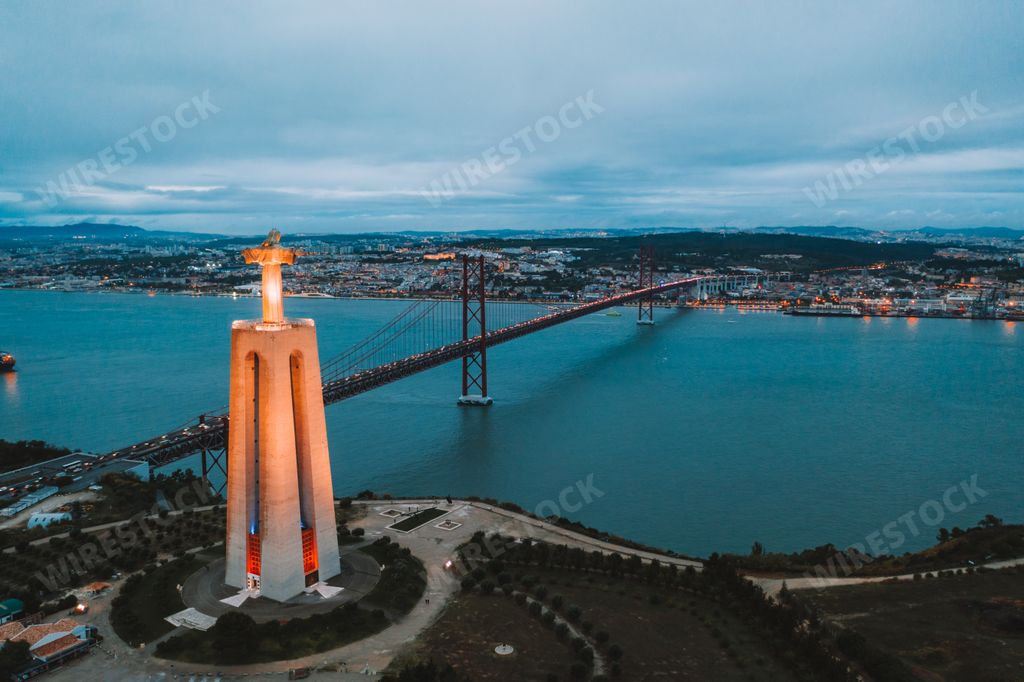 An aerial view of Cristo Rei Christ Statue in Lisbon in the evening time