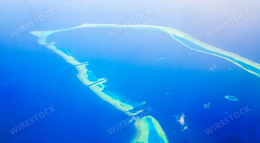 An amazing aerial view of the islands and atoll from above