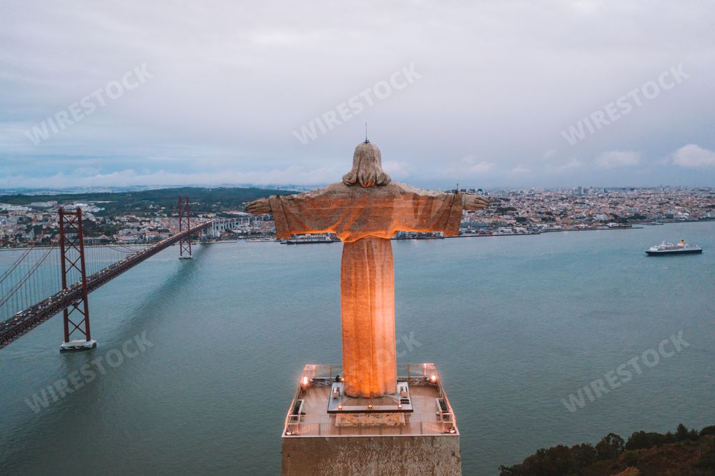 An aerial shot of Cristo Rei Christ Statue in Lisbon overlooking the city