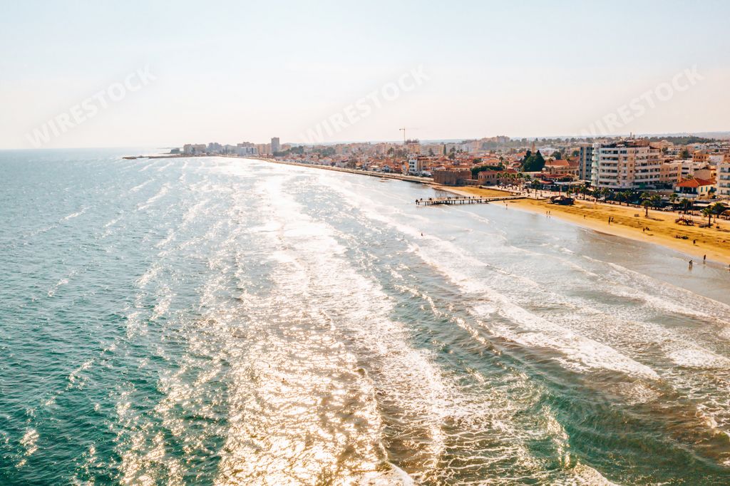 A beautiful view of the main street of Larnaca near the castle of Larnaca and Phinikoudes beach in Cyprus