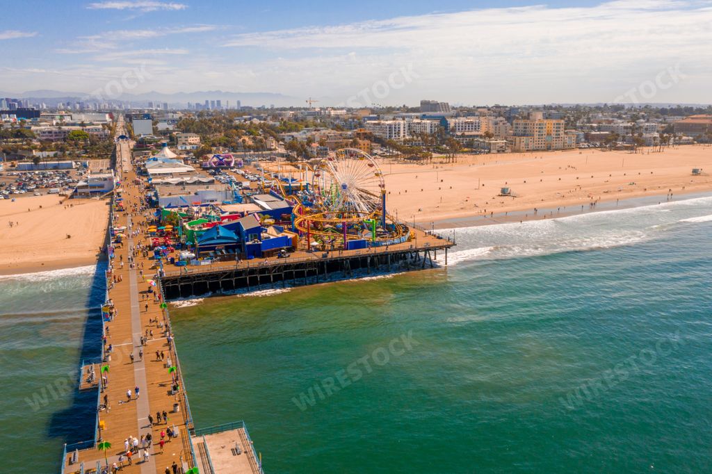 An aerial view of the Santa Monica Pier on a busy day  in California