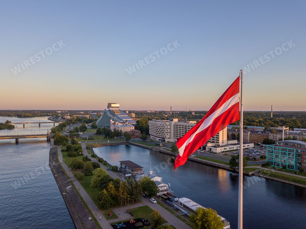 A closeup of the flag of Latvia in the AB Dam park under the sunlight in Riga