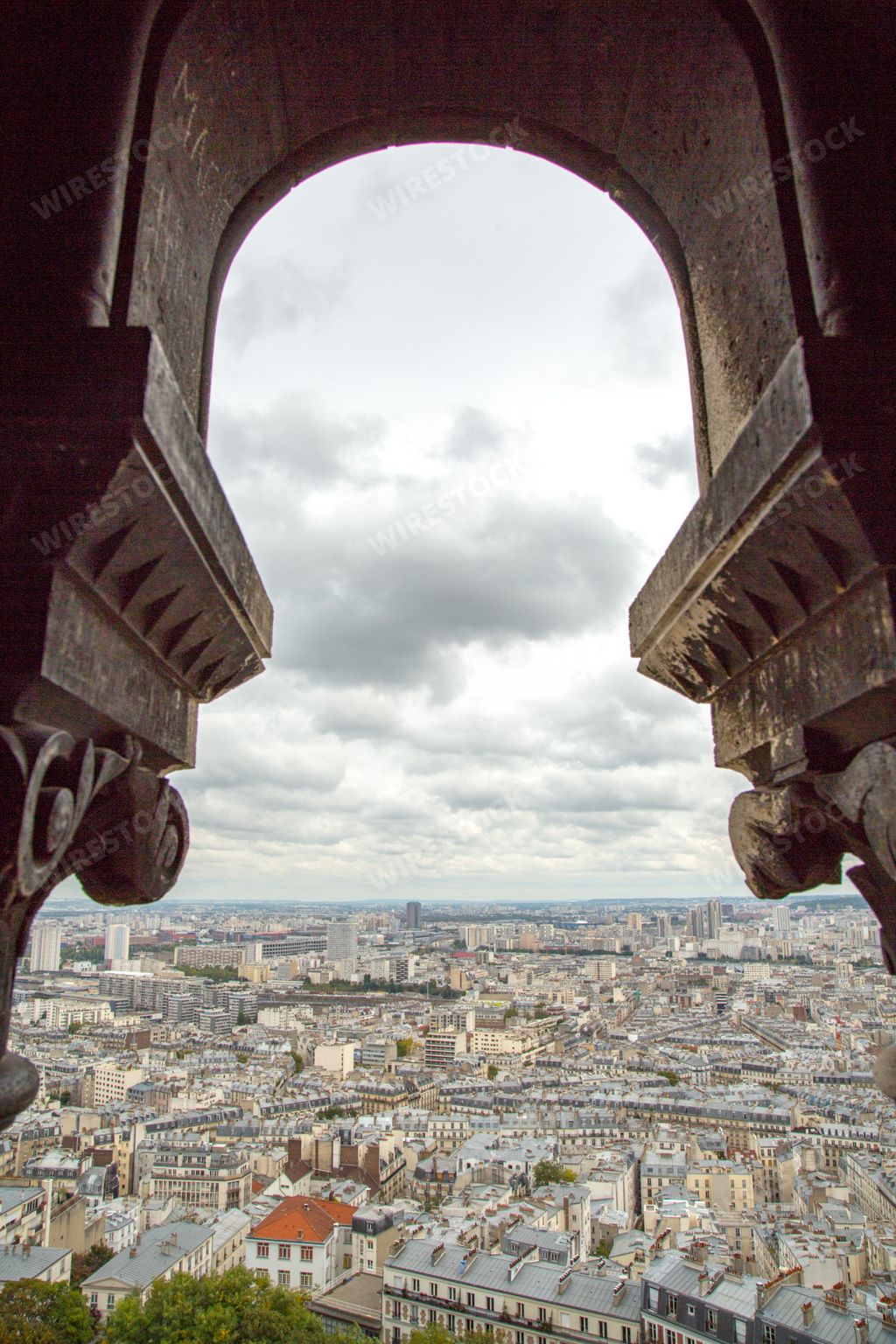 A vertical shot of overlooking buildings inside the Eiffel Tower in Paris, France