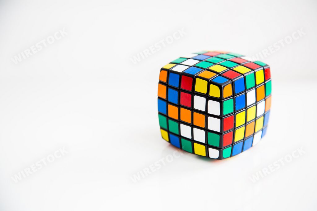 A closeup of a colorful cube toy isolated on a white background