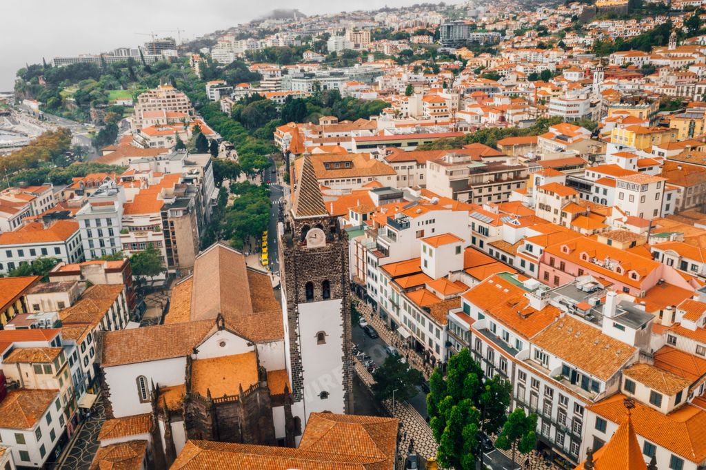 An aerial view of the Funchal old town, Madeira island with orange rooftops