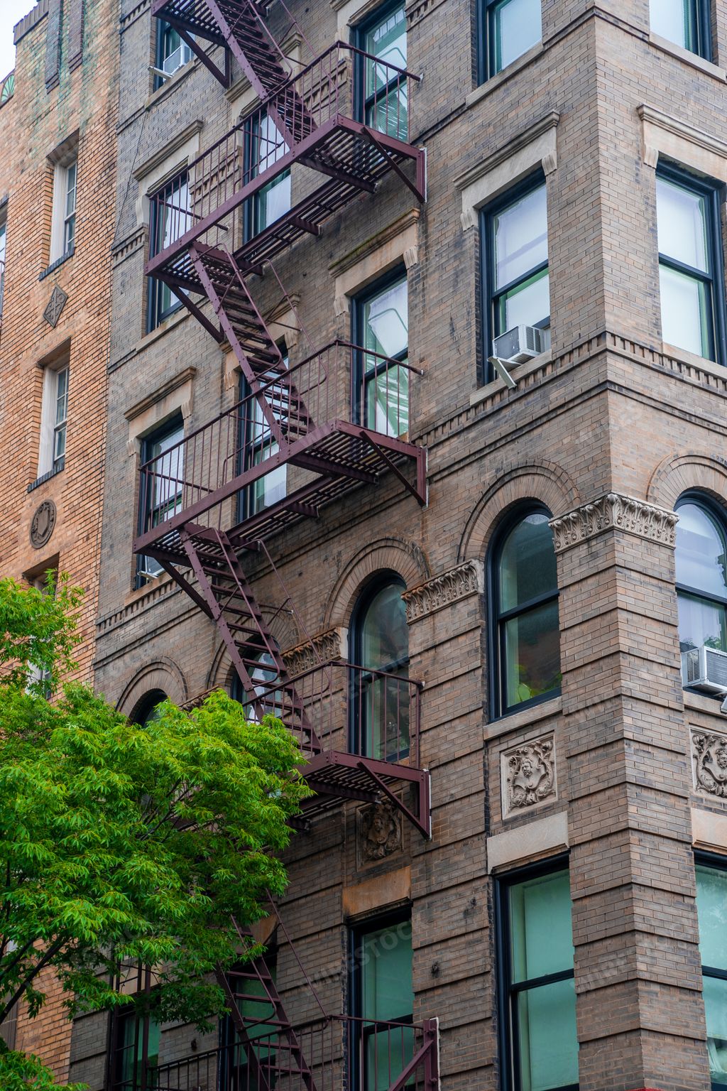 A vertical shot of the building of the "Friends" show apartment in New York, USA