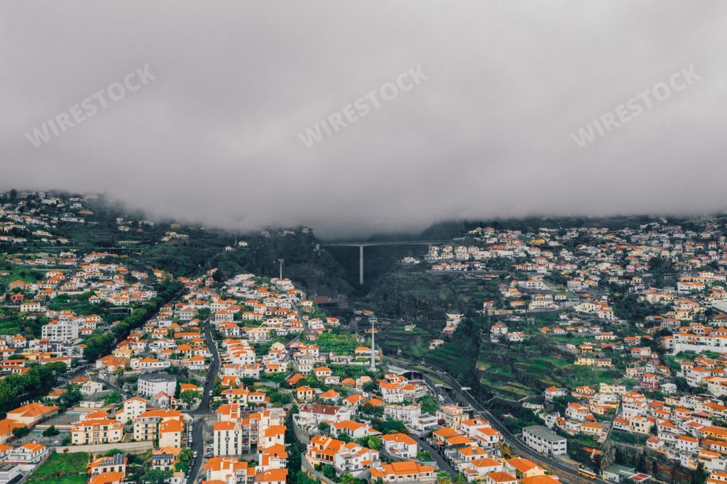 An aerial view of the Funchal old town in Madeira island during cloudy weather
