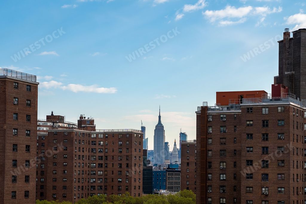 A closeup view of the Empire state building in the evening time