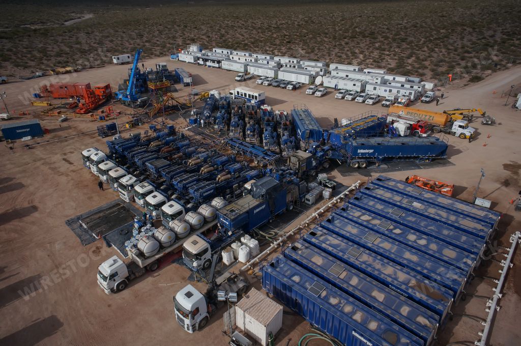 An aerial shot of battery of pumping trucks for hydraulic fracturing